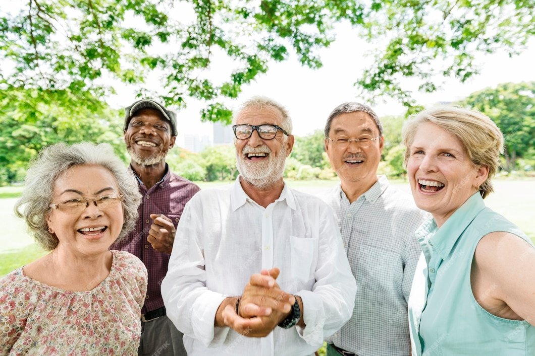 Group of joyful senior cancer survivors celebrating life and wellness after treatment at CurePoint Cancer Center.